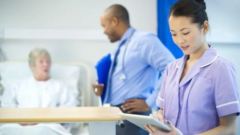 Doctor and a nurse with a patient